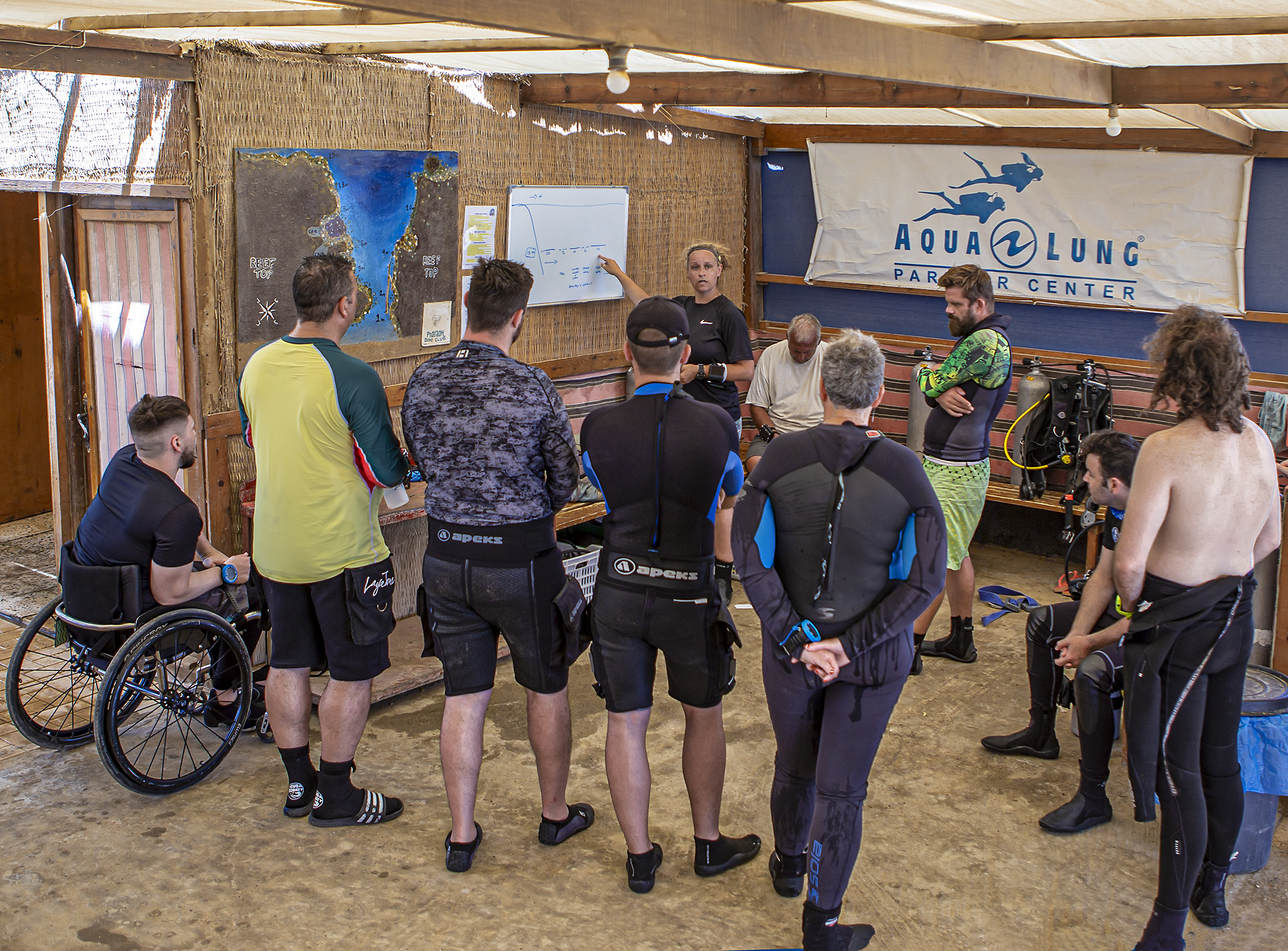 A group of beneficiaries listen to a briefing on expedition. Photo – Dmitry Knyazev for Deptherapy